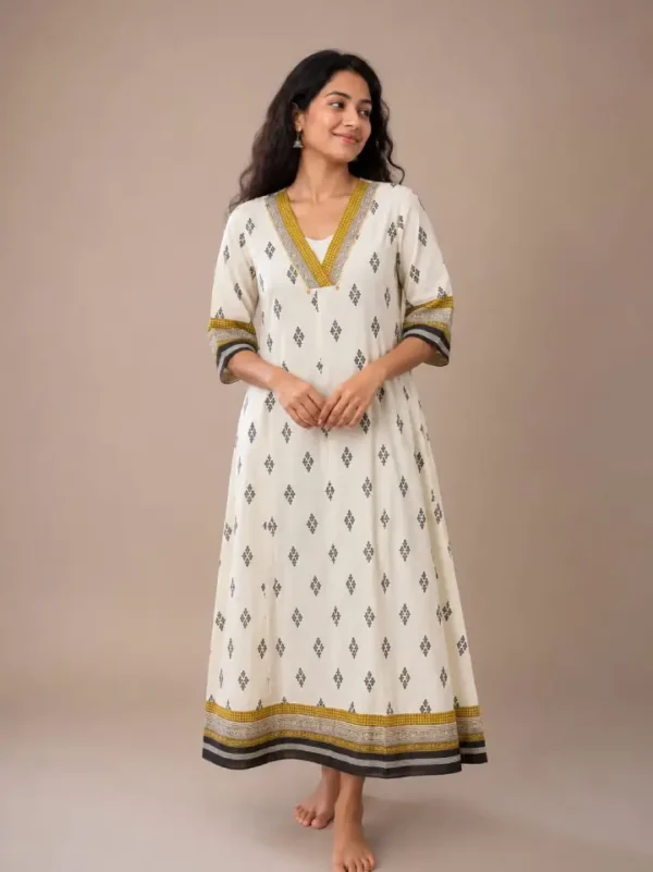 NEW An Elegant Ivory Kurti With Geometric Diamond Prints And Contrasting Mustard And Black Borders(Kurti Only)