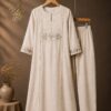 Elegant Ivory Kurti Set Featuring Delicate Floral Aplaque And Subtle Golden Detailing For A Timeless Graceful Look.