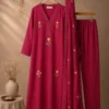 A Vibrant Deep Red Ethnic Suit Featuring A Lace-Trimmed, Embroidered Kurti With Matching Trousers And Dupatta