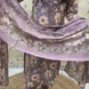 A Mauve Floral-Print Ethnic Ensemble Featuring An Embroidered Kurta, Matching Straight Trousers, And A Coordinating Dupatta