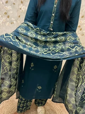 navy blue (1) A Deep Teal Kurti Set With Subtle Embroidery, Paired With Printed Pants And A Matching Floral Dupatta Draped Elegantly