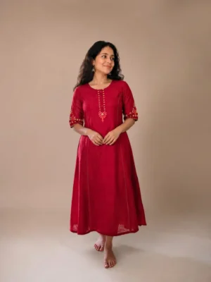 red Deep Red Dress Features A Flowing Silhouette With Delicate Art Work 0n The Neckline And Sleeves(Only Kurti)